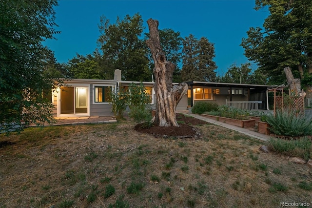 6057 S Windermere Way, Littleton, CO 80120 - ranch-style house featuring a chimney and a front yard