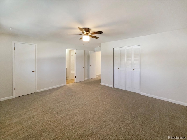 unfurnished bedroom featuring connected bathroom, ceiling fan, and carpet