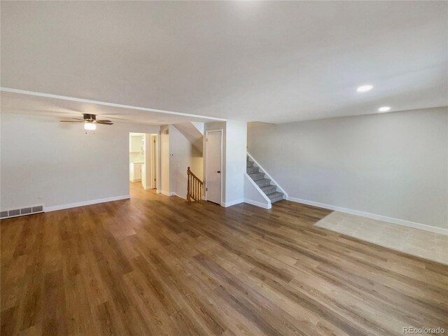 unfurnished living room featuring hardwood / wood-style flooring