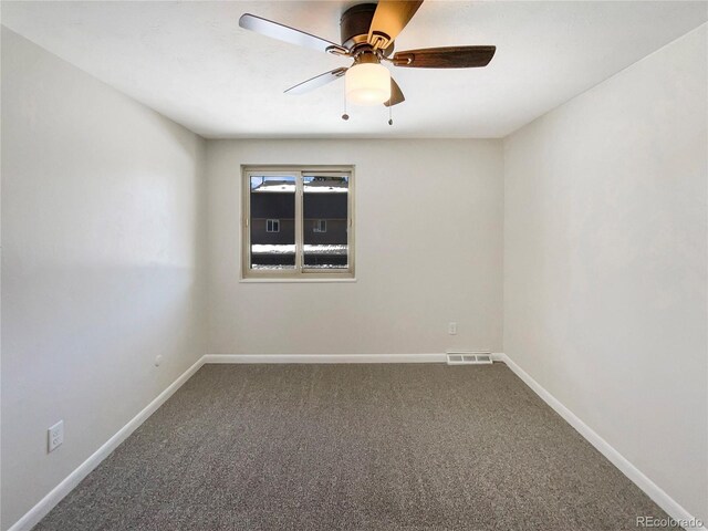 empty room featuring ceiling fan and carpet floors