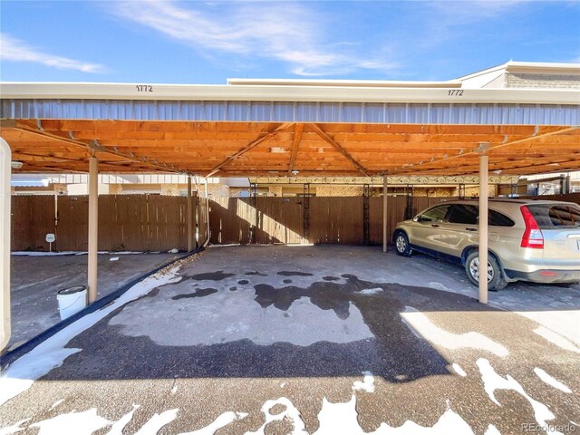 view of parking / parking lot with a carport