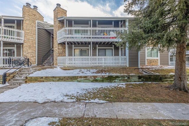 view of front of house featuring a balcony