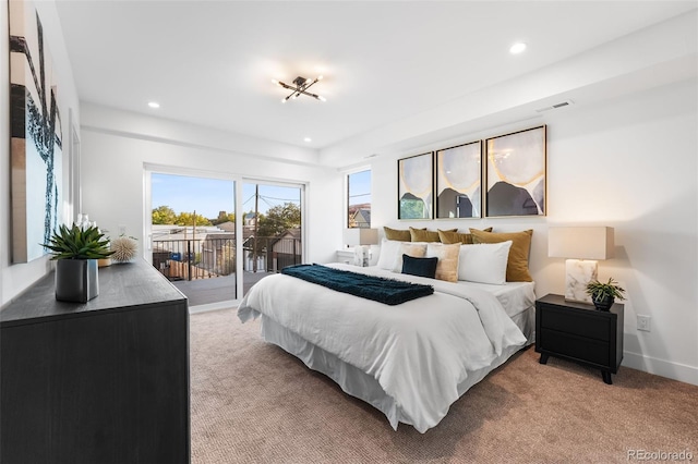 bedroom featuring light carpet and access to outside