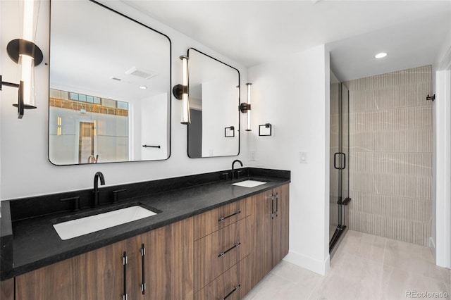 bathroom with vanity, tile patterned floors, and an enclosed shower