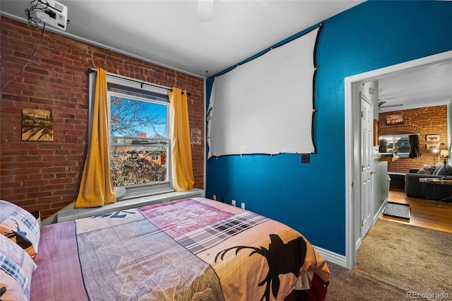 1450 N High St Unit 3, Denver, CO 80218 - bedroom featuring brick wall, ceiling fan, and carpet flooring