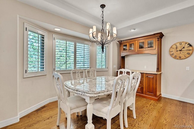 dining area featuring a chandelier, light wood-type flooring, plenty of natural light, and recessed lighting