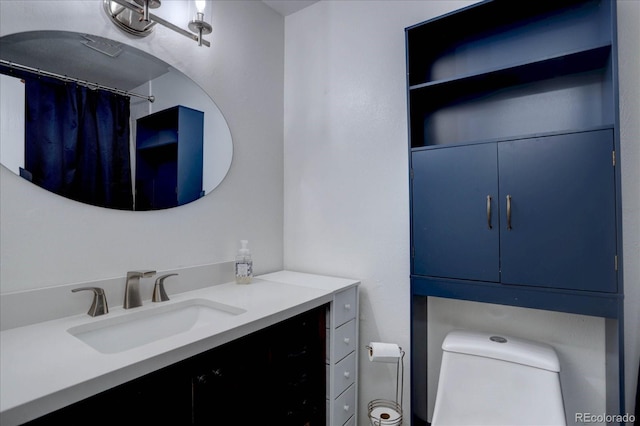 bathroom with vanity and toilet