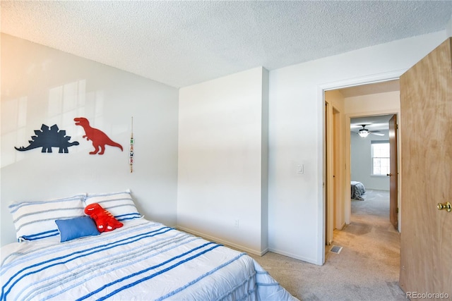 1641 S Idalia Cir Unit F, Aurora, CO 80017 - bedroom with carpet, a textured ceiling, and baseboards