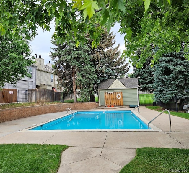 1641 S Idalia Cir Unit F, Aurora, CO 80017 - view of pool with a patio and an outbuilding