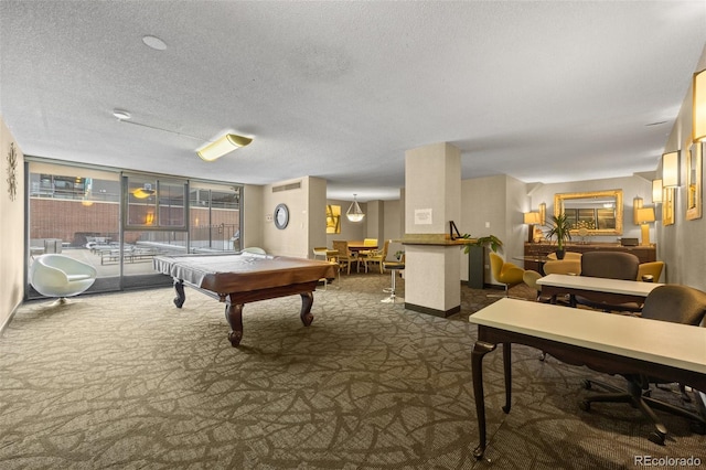 game room featuring pool table, carpet floors, and a textured ceiling