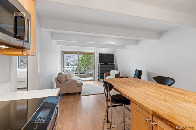 220 E Ln Bonte St Unit 317, Dillon, CO 80435 - office space featuring beam ceiling and light wood finished floors