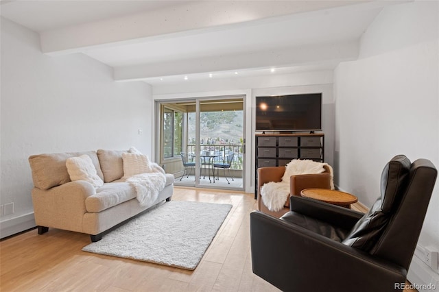 220 E Ln Bonte St Unit 317, Dillon, CO 80435 - living area featuring wood finished floors and beamed ceiling