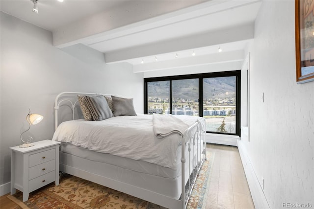 220 E Ln Bonte St Unit 317, Dillon, CO 80435 - bedroom featuring beamed ceiling