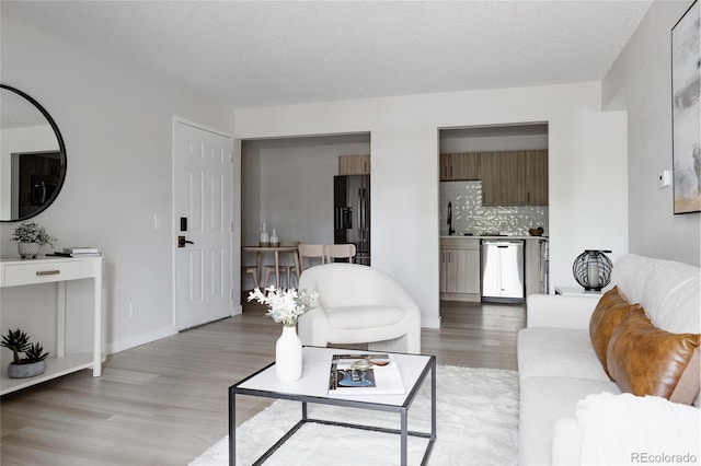 7395 E Eastman Ave Unit 202N, Denver, CO 80231 - living area featuring light wood-style floors