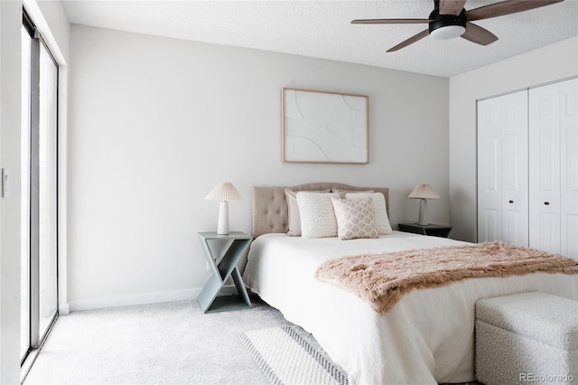 7395 E Eastman Ave Unit 202N, Denver, CO 80231 - bedroom featuring a closet, light colored carpet, baseboards, and ceiling fan
