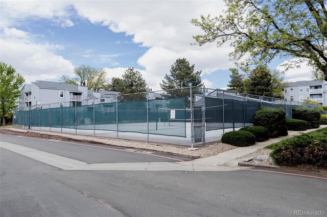 7395 E Eastman Ave Unit 202N, Denver, CO 80231 - view of tennis court featuring fence and a residential view