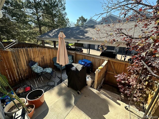 11576 E Bayaud Dr, Aurora, CO 80012 - view of patio / terrace featuring a fenced backyard