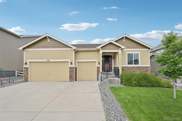 17710 E Emilia Dr, Parker, CO 80134 - craftsman-style house with a garage, driveway, stone siding, and a front lawn