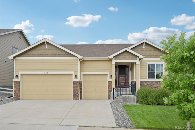 17710 E Emilia Dr, Parker, CO 80134 - craftsman inspired home featuring a garage, stone siding, concrete driveway, and a front yard