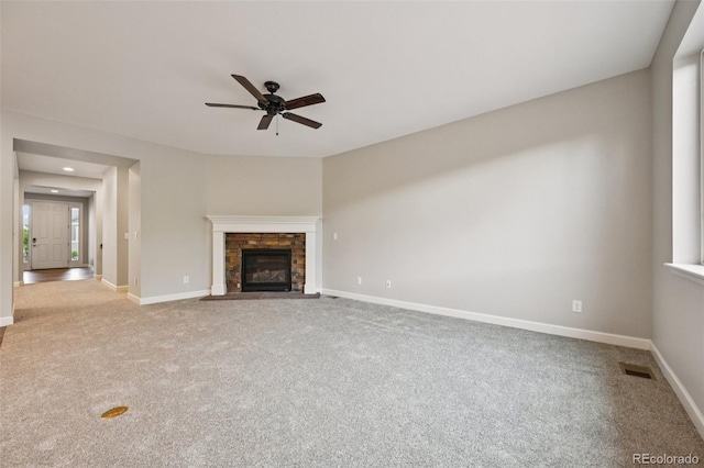 17710 E Emilia Dr, Parker, CO 80134 - unfurnished living room with a ceiling fan, carpet flooring, a stone fireplace, and recessed lighting