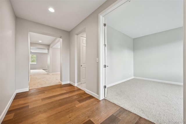17710 E Emilia Dr, Parker, CO 80134 - corridor with wood finished floors, recessed lighting, and carpet flooring