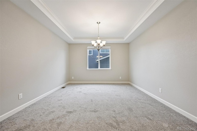 17710 E Emilia Dr, Parker, CO 80134 - carpeted empty room featuring a chandelier, a tray ceiling, and ornamental molding