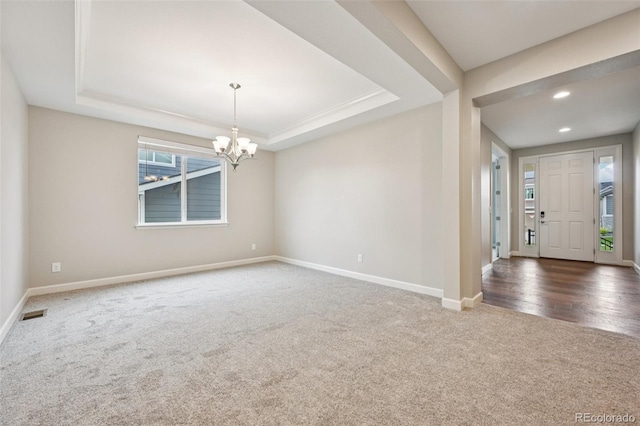 17710 E Emilia Dr, Parker, CO 80134 - foyer featuring carpet, a chandelier, a raised ceiling, and recessed lighting