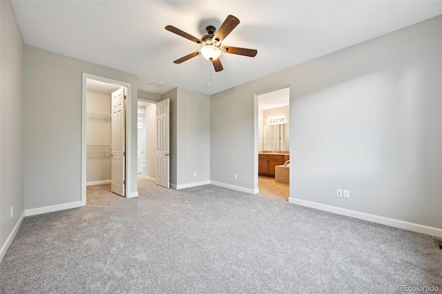 17710 E Emilia Dr, Parker, CO 80134 - unfurnished bedroom with a spacious closet, light carpet, a closet, and ceiling fan