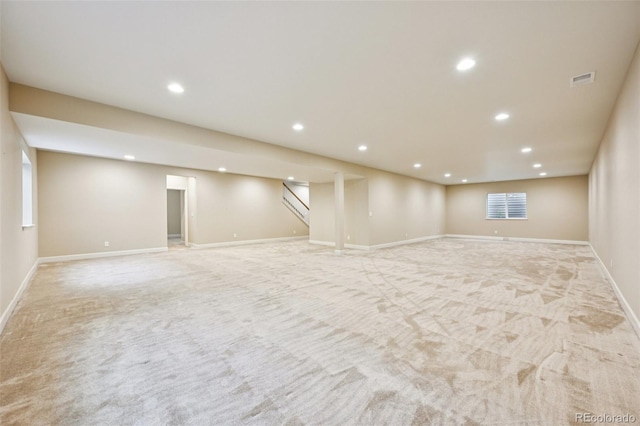 17710 E Emilia Dr, Parker, CO 80134 - basement featuring light colored carpet, recessed lighting, and stairway