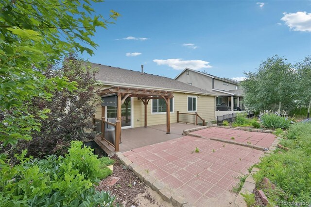 17710 E Emilia Dr, Parker, CO 80134 - rear view of house featuring a pergola, a patio area, and a shingled roof