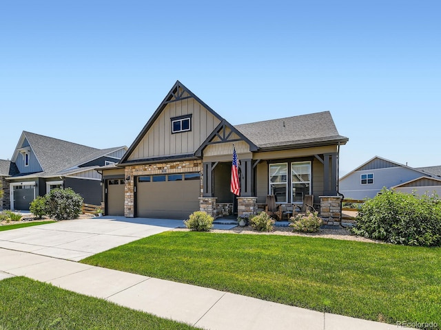 7702 E 157th Ave, Thornton, CO 80602 - craftsman inspired home featuring board and batten siding, covered porch, a garage, a front lawn, and driveway