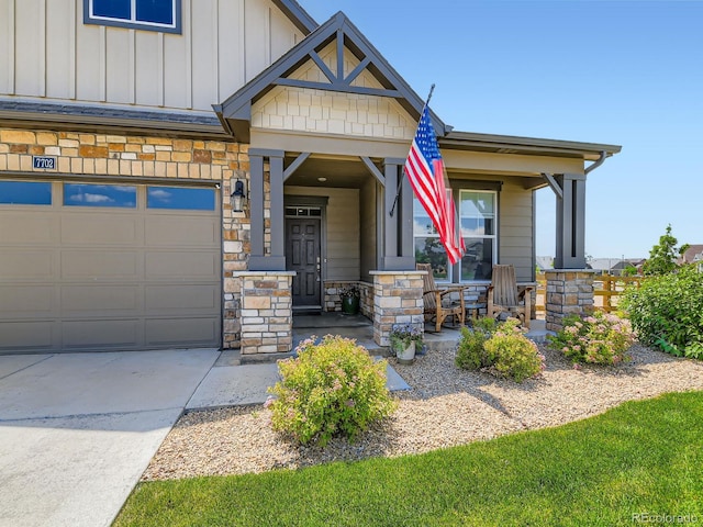 7702 E 157th Ave, Thornton, CO 80602 - craftsman house featuring stone siding, a porch, board and batten siding, and driveway