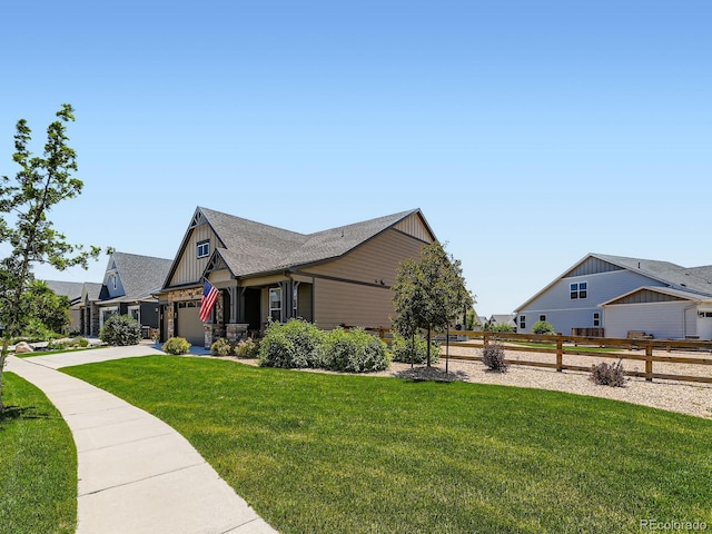 7702 E 157th Ave, Thornton, CO 80602 - view of side of home featuring concrete driveway, a garage, and board and batten siding