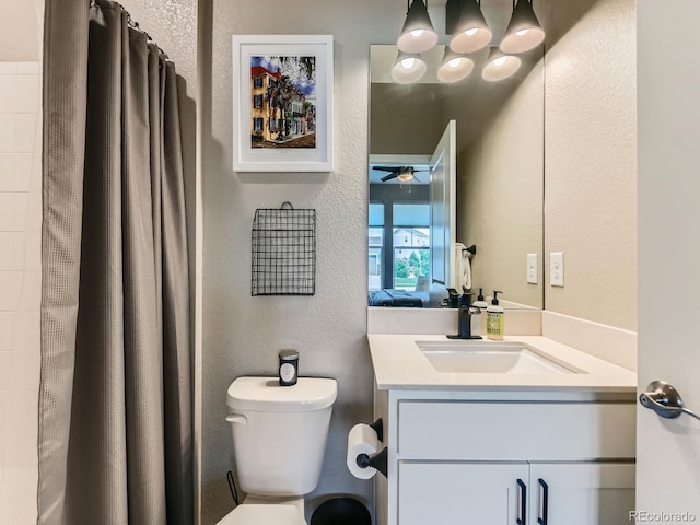 7702 E 157th Ave, Thornton, CO 80602 - full bathroom with vanity, a textured wall, ceiling fan, and curtained shower