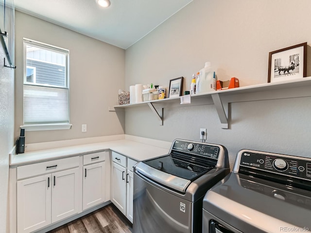 7702 E 157th Ave, Thornton, CO 80602 - washroom featuring washing machine and dryer, wood finished floors, and cabinet space