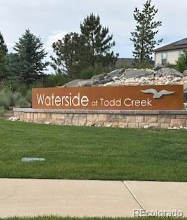 7702 E 157th Ave, Thornton, CO 80602 - community sign featuring a lawn