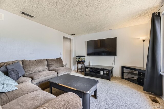 15705 E Brown Ave, Aurora, CO 80013 - living room featuring a textured ceiling and carpet floors