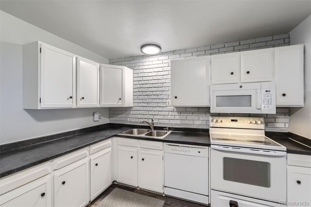 15705 E Brown Ave, Aurora, CO 80013 - kitchen with white appliances, white cabinets, dark countertops, and decorative backsplash