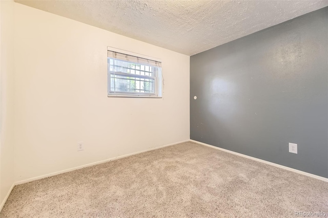 15705 E Brown Ave, Aurora, CO 80013 - carpeted empty room featuring a textured ceiling and baseboards