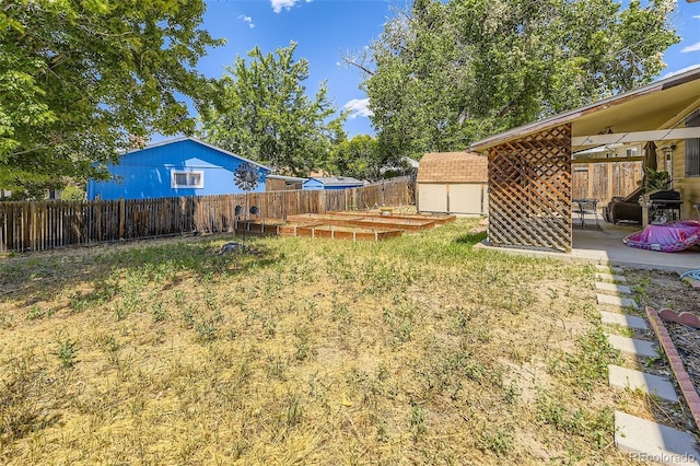 15705 E Brown Ave, Aurora, CO 80013 - fenced backyard with a shed and a patio