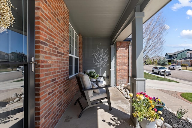 7106 Cerney Cir, Castle Pines, CO 80108 - view of patio / terrace featuring a residential view and covered porch