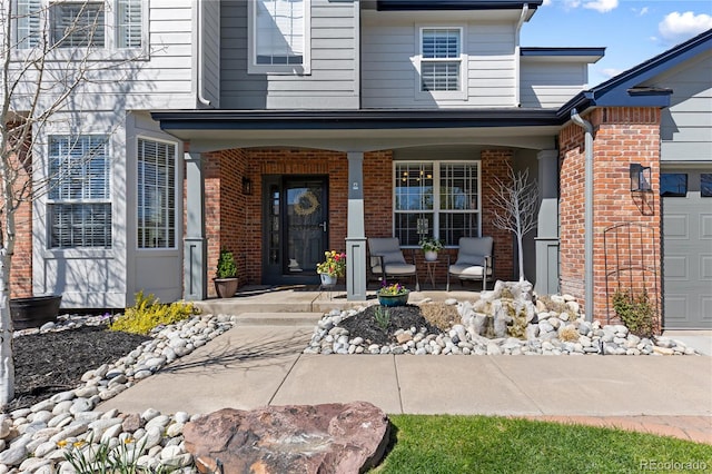 7106 Cerney Cir, Castle Pines, CO 80108 - entrance to property with a garage, covered porch, and brick siding