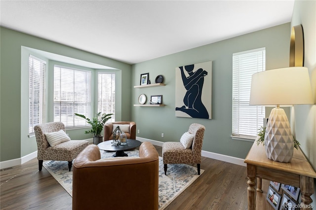 7106 Cerney Cir, Castle Pines, CO 80108 - living area with dark wood-style flooring, baseboards, and plenty of natural light