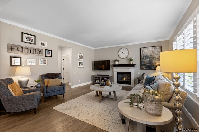 7106 Cerney Cir, Castle Pines, CO 80108 - living room with crown molding, baseboards, a brick fireplace, and wood finished floors