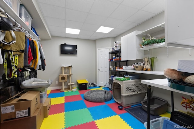 7106 Cerney Cir, Castle Pines, CO 80108 - playroom with tile patterned floors and a drop ceiling