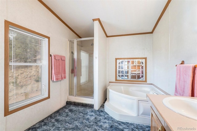 bathroom featuring crown molding, shower with separate bathtub, and vanity