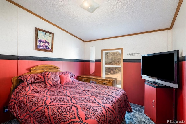 bedroom with vaulted ceiling, a textured ceiling, and dark colored carpet