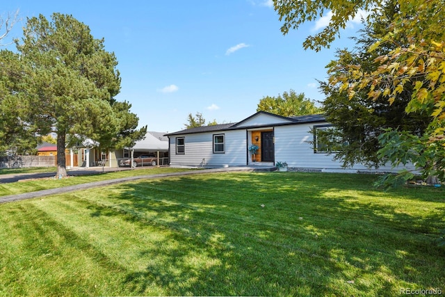 single story home with a front lawn