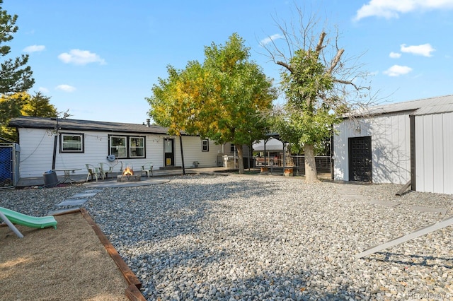 exterior space with a patio and a storage shed