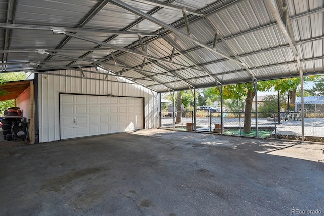 garage featuring a carport